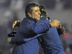 Carlos Reinoso festeja el pase del América a los octavos de final de la Copa Libertadores. AP  /
