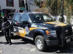 Miembros de la Policía de Zapopan indagan sobre el caso. ARCHIVO  /