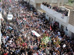 Aspecto del funeral del policía Mohammed Ali Saqa, que fue muerto por los opositores al mandatario. AFP  /