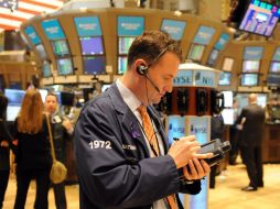 Al final de esta segunda sesión de la semana sólo 4 de los 30 integrantes del Dow Jones cerraron en números rojos. EFE  /