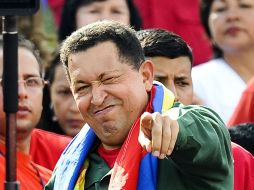 El Gobierno de Hugo Chávez (foto), califica de “poco fiable” el informe del IISS. AFP  /