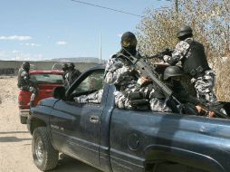 Agentes de la Procuraduría General de Justicia del Estado de Jalisco investigan el homicidio. ARCHIVO  /