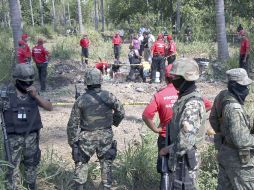 El hallazgo de fosas con cientos de cadáveres aumenta la lista de muertes violentas en el país. AFP  /