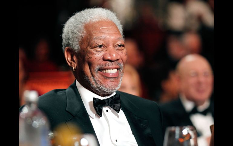 Freeman mostraba una deslumbrante sonrisa desde su asiento en la mesa central. AFP  /