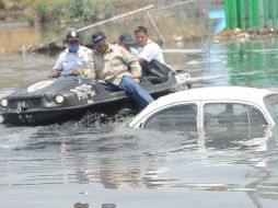 Protección Civil informó que la onda tropical cuatro afectará más al centro y norte de Quintana Roo con lluvias y nubosidad. ARCHIVO  /