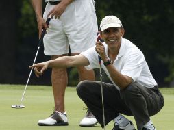 Barack Obama y John Boehner (izquierda) lograron la victoria en el hoyo 18. REUTERS  /