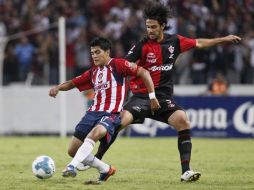 Jugadores de Atlas y Guadalajara, durante partido de la Copa Chivas en el Estadio Jalisco. E.PACHECO  /