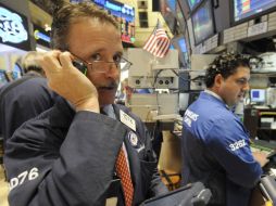 El índice Dow Jones registró una baja de 0.49%. AP  /