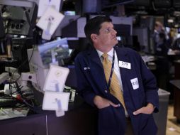 Mientras que el Dow Jones registra un ascenso, la Bolsa Mexicana de Valores registra pérdidas. AP  /