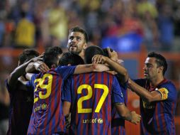 El conjunto español celebra el único gol que logró tener en el partido contra el Guadalajara. AFP  /
