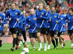 El equipo del Manchester United durante una sesión de entrenamiento ante el público. AFP  /