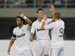 Jugadores del Real Madrid celebran triunfo durante partido amistoso contra el Tianjin Teda. NOTIMEX  /