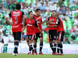 Los jugadores de Tijuana celebran una de las anotaciones en el partido. MEXSPORT  /