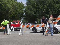 La calle en donde ocurrieron los tiroteos fue cerrada para continuar con las investigaciones. AP  /