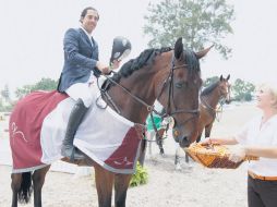 Juan Vicente Mendoza, jinete de la Escuela Hípica Jalisciense, con su caballo ''Uno Momento''. M. FREYRÍA  /