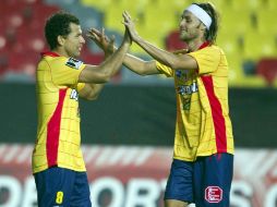 Miguel Sabah y Luis Gerardo Lugo de Monarcas , durante juego de la Liga de Campeones contra Tempete. MEXSPORT  /