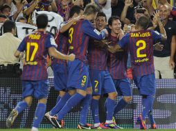 Villa, Messi y los demás jugadores del Barcelona celebran su triunfo. AFP  /