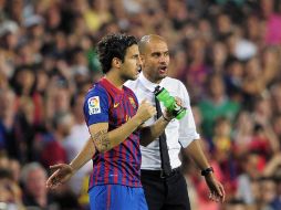 Pep Guardiola y Cesc Fábregas en el partido de la Supercopa de España contra Real Madrid. AP  /