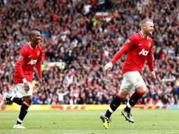 El jugador del Manchester United, Wayne Rooney (D), anotó tres tantos en el partido ante el Arsenal. AP  /