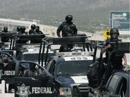 Ayer por la tarde arribaron a Monterrey otros mil elementos de la Policía Federal. AP  /
