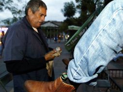 Boleros y demás prestadores de servicios preparados para temporada alta. ARCHIVO  /