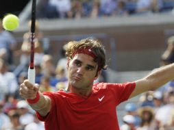 Roger Federer  regresa un pase a Marin Cilic de croacia durante el U.S. Open de Nueva York. AP  /