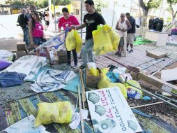 En la imagen, activistas israelíes levantan campamento en el centro de Tel Aviv tras más de seis semanas de protestas. AFP  /