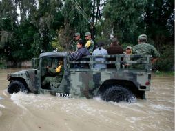 Sedesol y Conagua estiman afectaciones por inundaciones en mil 700 familias de la localidad. AP  /