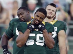 Los Empacadores Brad Jones (Frente), Ricky Elmore (D) y Howard Green durante un entrenamiento. AP  /