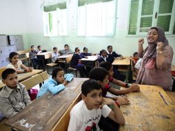 Escolares libios asisten a clases, luego de meses de permanecer aislados por la guerra que logró derrocar a Muamar Gadhafi. REUTERS  /