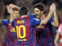 David Villa celebra junto con Messi gol contra el Atlético de Madrid. AFP  /