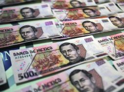 La moneda mexicana puede recuperar más terreno frente al dólar, para alcanzar 13.15 pesos por billete verde, estiman analistas.  /