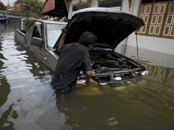 Los daños por las inundaciones ascienden a 190 mil millones de baht. AFP  /