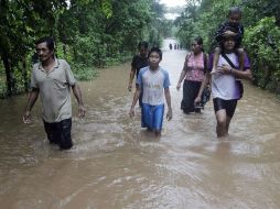 En El Salvador, las lluvias de la última semana rompieron los récords históricos de precipitación registrados por Mitch. AFP  /