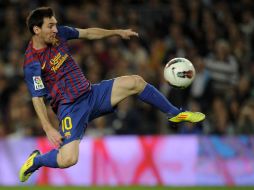 Messi en acción durante el encuentro de barcelona contra Sevilla en la novena jornada de la Liga Española. AFP  /