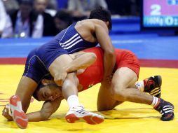 Torres (de rojo) puede dar al país anfitrión la siguiente presea áurea. NOTIMEX  /