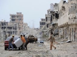 El nuevo gobierno de Libia tiene la misión de reunificar al devastado país tras la confirmación del retiro de fuerzas de la OTAN. AFP  /