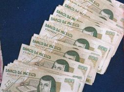 En la jornada de hoy, el peso reaccionó positivamente tras el anuncio de la cancelación del referendo en Grecia. ARCHIVO  /