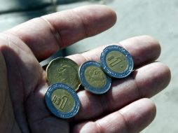 La moneda nacional perdió a causa de la incertidumbre financiera mundial. ARCHIVO  /