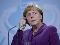 Merkel celebró la voluntad de Rumanía de sumarse a la eurozona en 2015. AFP  /