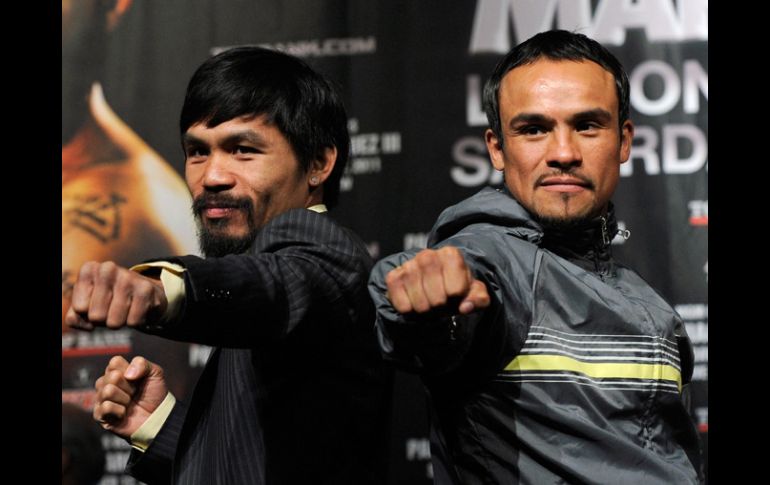 El púgil filipino Manny Pacquiao (i) y el mexicano Juan Manuel Márquez (d) se medirán el próximo sábado en Las Vegas. AFP  /