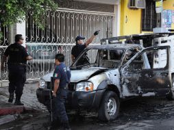 En un primer hecho fueron hallados 17 cuerpos en dos vehículos en zonas céntricas de Culiacán, Sinaloa. AFP  /