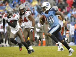 Chris Johnson (der) tuvo su mejor juego en la campaña 2011. AP  /