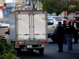 El pasado jueves, policías localizaron 26 cadáveres en tres vehículos abandonados en las inmediaciones de los Arcos del Milenio. AFP  /
