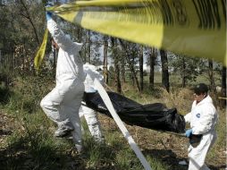 Una de las personas asesinadas es una mujer , la cual fue ultimada con arma de fuego. Las autoridades investigan el móvil del crimen.  /