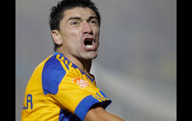 Héctor Mancilla celebra su anotación clave en el partido de hoy. AP  /