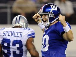 Eli Manning de los Gigantes de New York completó 27 de sus 47 pases. EFE  /