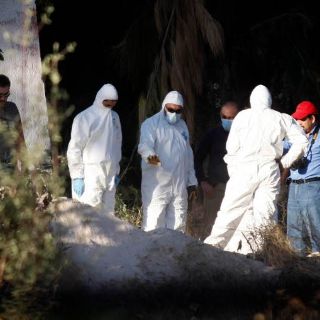 Padre e hijo hallados en fosa murieron por impactos de bala