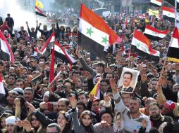 Ciudadanos se manifiestan en apoyo del régimen del presidente Bachar el Asad en Damasco, Siria. EFE  /