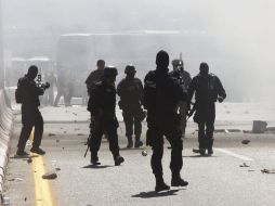 Debido a las agresiones por parte de policías contra los normalistas, diputados exigen que haya una comisión. EFE  /